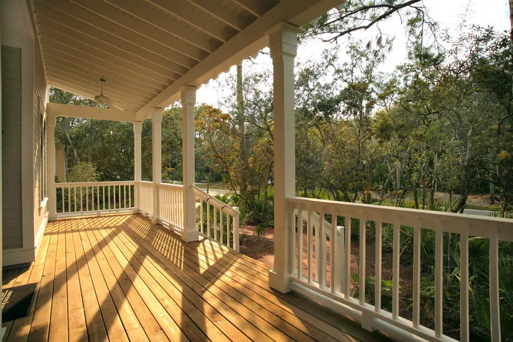 Porch builders Sussex WI creating an inviting outdoor porch with seating and greenery near Pewaukee