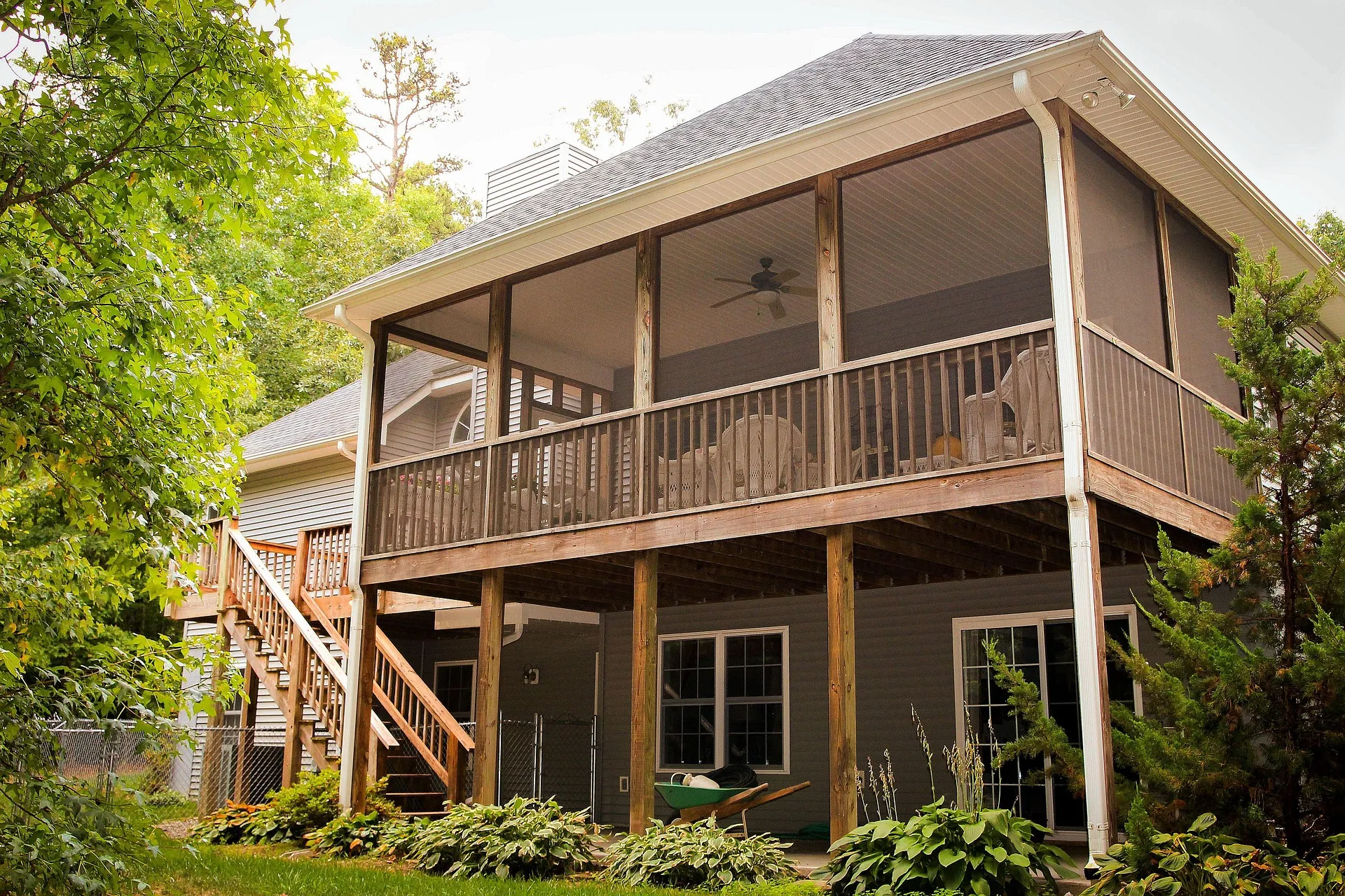 Deck installation Sussex WI with a beautiful backyard deck and outdoor furniture near Pewaukee