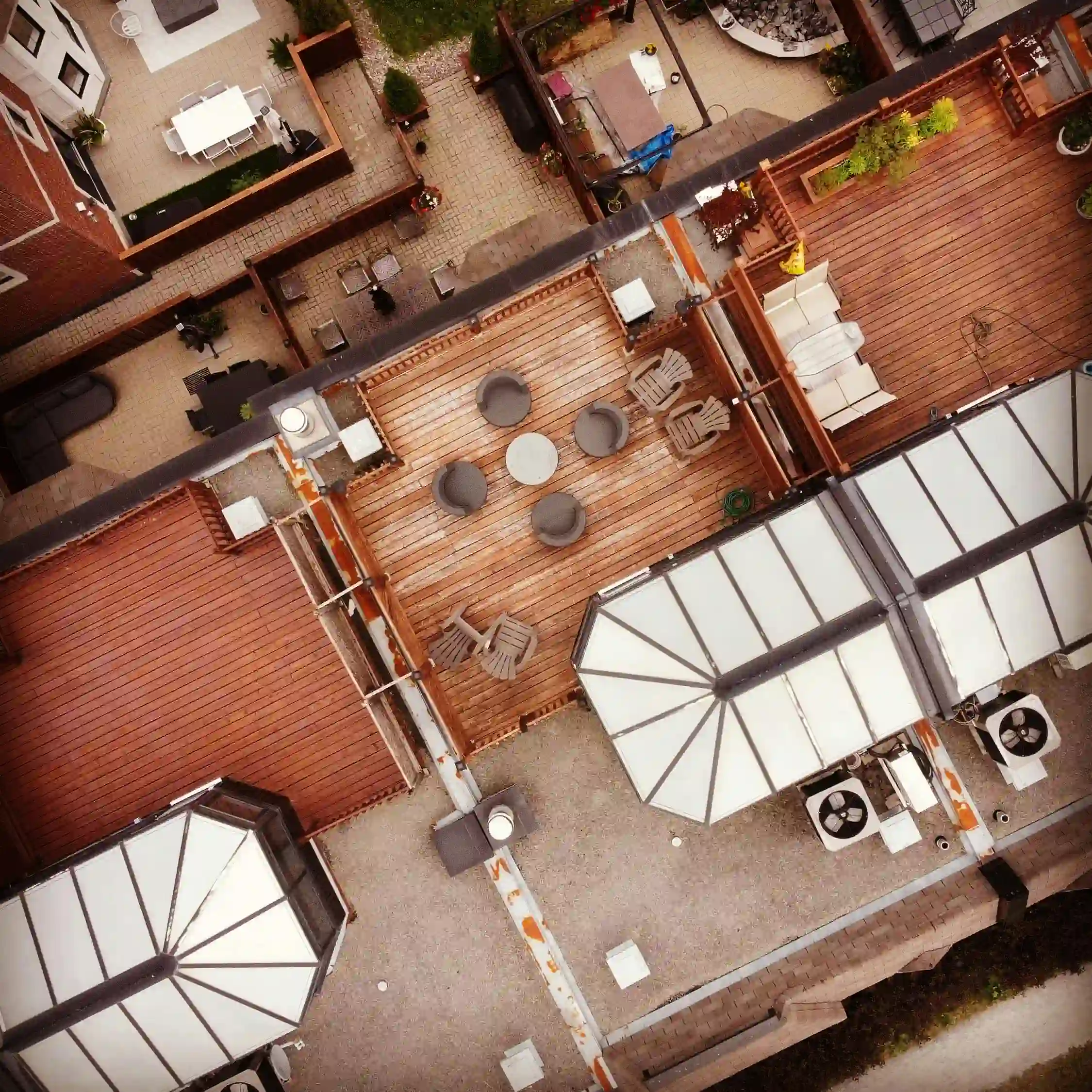 Freestanding floating deck built on a sloped yard by innovative Deck Builders Sussex WI.